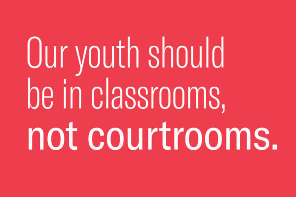 Red image with white text reads "Our youth should be in classrooms, not courtrooms."