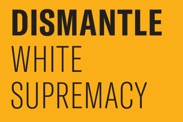 Black text on a gold background says "Dismantle White Supremacy."