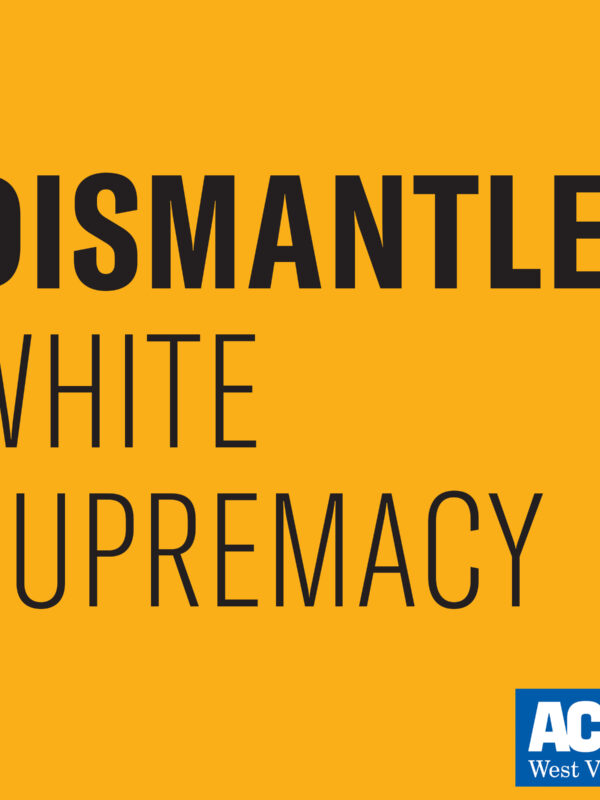 Black text on a gold background says "Dismantle White Supremacy."