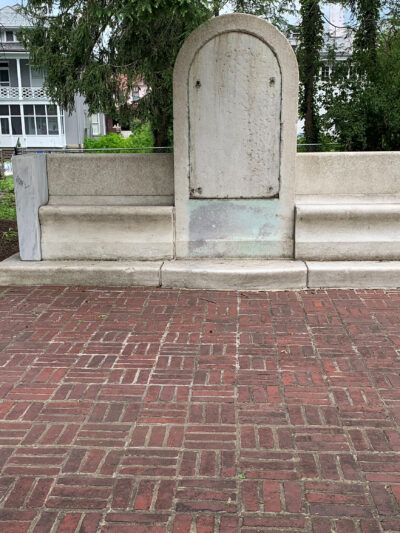 A blank monument is shown after a confederate plaque was removed from its face