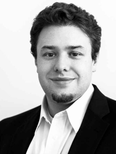 Black and white portrait of ACLU-WV Policy Director Eli Baumwell