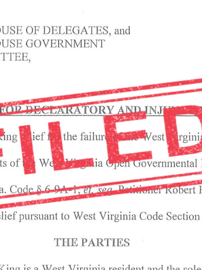 "Filed" stamped in red over an image of a lawsuit