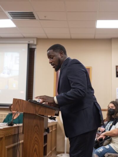 Dijon Stokes, ACLU-WV policy specialist, testifies to the Kanawha County Commission about the need for a new polling place on Charleston's West Side.