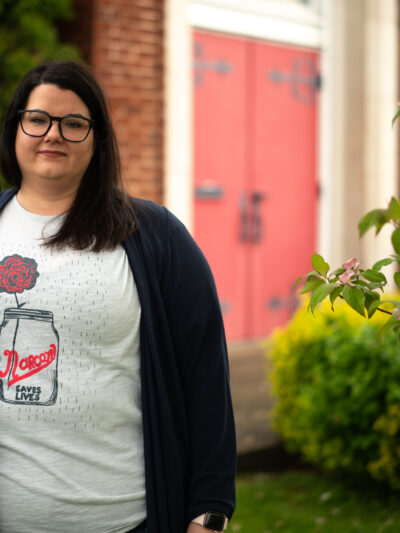 Carrie Ware in a tee shirt that reads "Narcan Saves Lives"