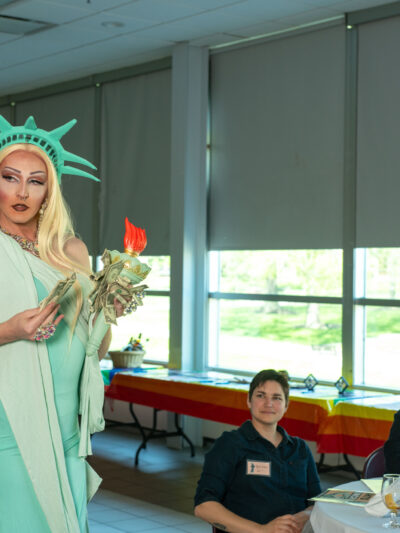 Mystique Monroe, dressed as Lady Liberty, performs a number for attendees.