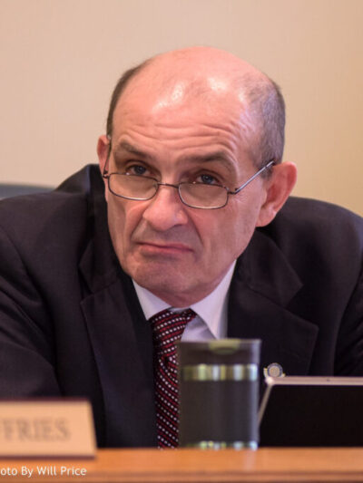 Senate President Randy Smith listens to a speaker.