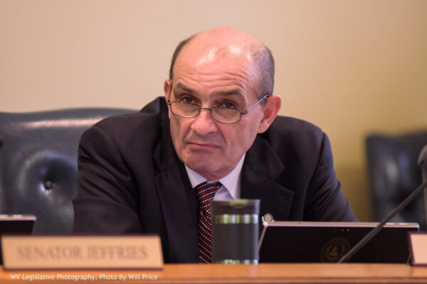 Senate President Randy Smith listens to a speaker.
