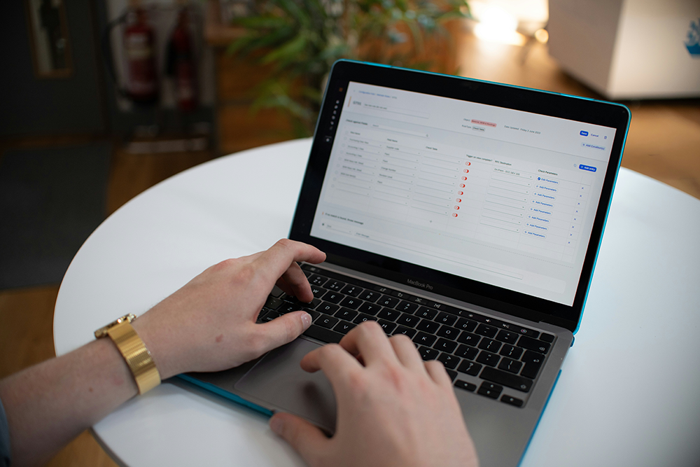 A person filling out a form on a laptop