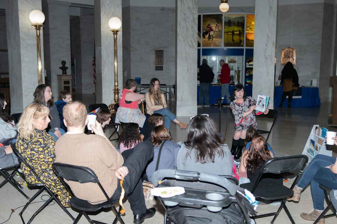 ACLU-WV staff member Rose Winland reads a challenged children's book to kids in the Capitol Rotunda.