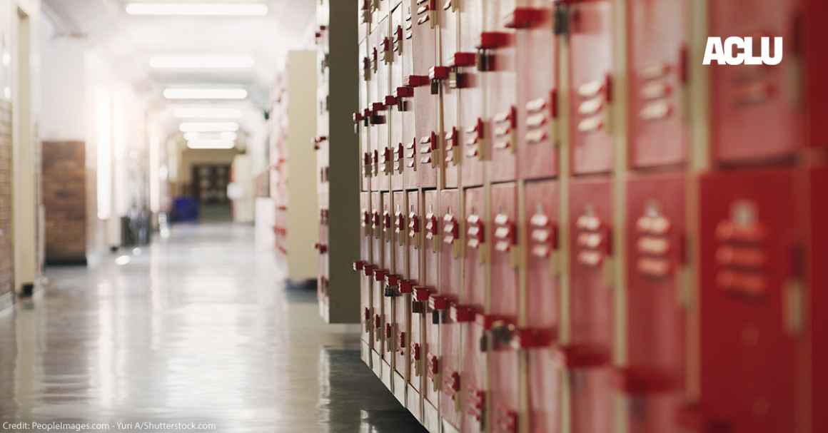 A photo of red lockers in a school hallway