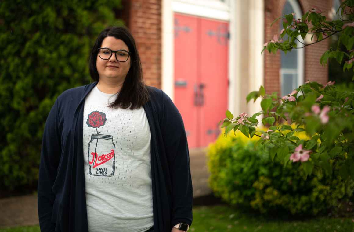 Carrie Ware in a tee shirt that reads "Narcan Saves Lives" 