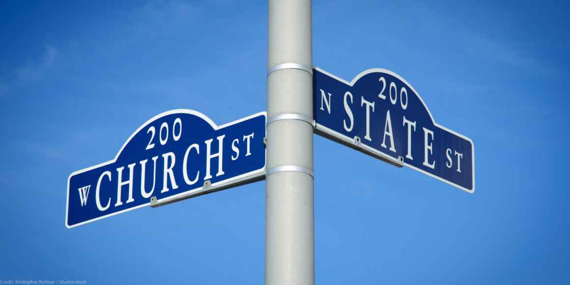 An intersection of Church and State streets is depicted with blue street signs set against a blue sky. 