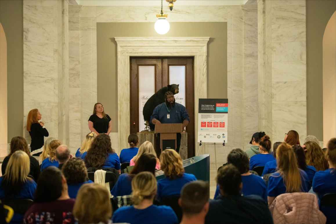 Kenneth Matthews speaks to a crowd of more than 100 justice impacted people at the state Capitol