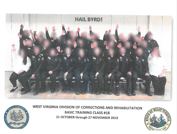 Image shows Class No. 18 with faces blurred raising hands in a Nazi-style salute