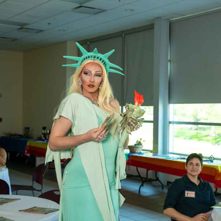 Mystique Monroe, dressed as Lady Liberty, performs a number for attendees. 