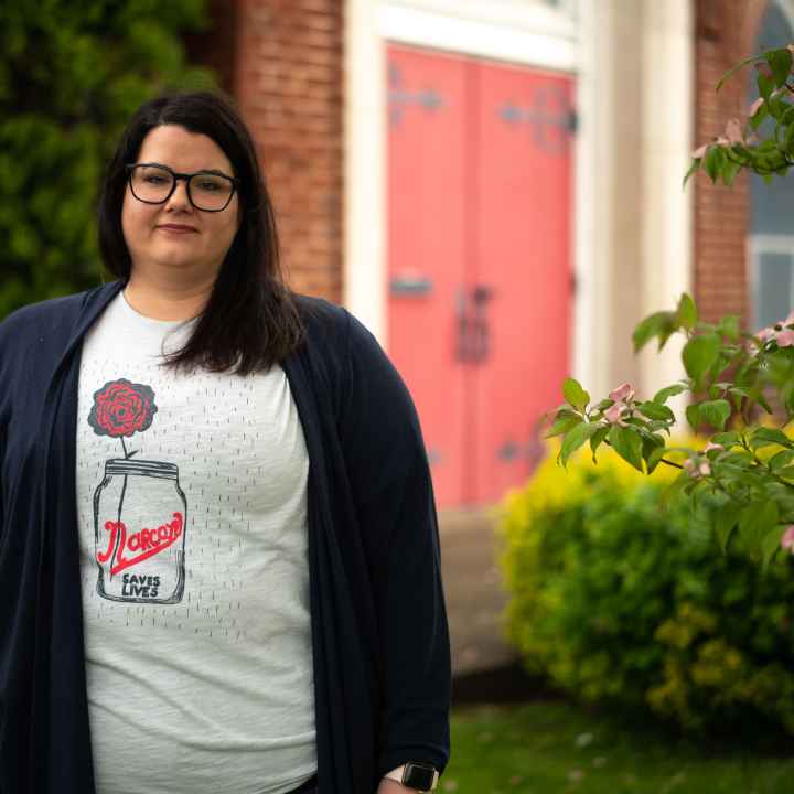 Carrie Ware in a tee shirt that reads "Narcan Saves Lives"