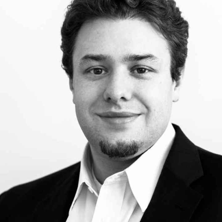 Black and white portrait of ACLU-WV Policy Director Eli Baumwell