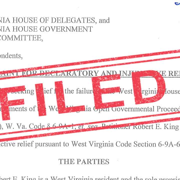 "Filed" stamped in red over an image of a lawsuit