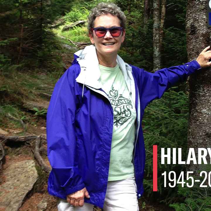 Hilary Chiz is shown hiking in the mountains 